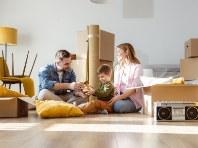 Father, Mother and Young Son move into New Home - Stock Photo