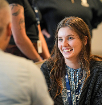 Woman with brown hair smiling