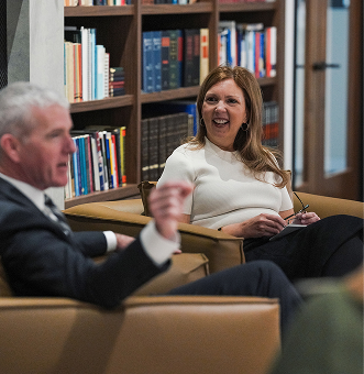 A man and a woman talking in a business setting
